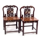 A pair of Chinese hardwood chairs,