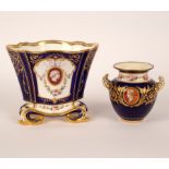 A Minton Sèvres style lozenge vase 'Hollandois' on scroll feet, painted portrait medallions,