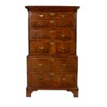 A George III walnut and feather banded chest on chest,