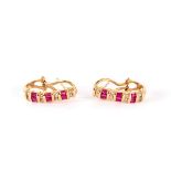A pair of ruby and diamond half hoop earrings, set in 14k yellow gold, maker RJM,