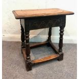 An 18th Century oak joint stool on baluster turned legs,