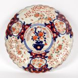A Japanese Imari charger with scalloped edge,