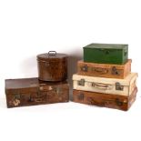 Four suitcases, a hat box and a strong box,