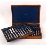 A Victorian set of twelve silver dessert forks and knives, London 1872,