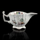 A Worcester fluted creamboat, circa 1752-53, the thin angular handle with a pronounced thumb rest,