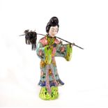 A Chinese export silver and enamel figure of a long Eliza,