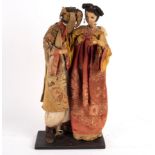 Two Japanese composition dolls in brocade costume,