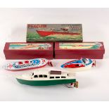 A Penguin long-range clockwork cabin cruiser, 28cm long,