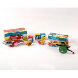 A tinplate pop-pop boat with candle and boiler, 17cm long, Rocket Racer with siren, 9cm long,