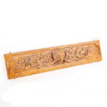 A simulated wood resin panel decorated foliage and centred by a lion mask,