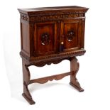 A 17th Century style walnut cabinet on stand in the Italian style,