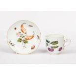 A Meissen botanical coffee cup and saucer, circa 1745, painted with nuts, fruit,