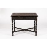 A 19th Century Indian ebonised table with blind fret carved decoration,