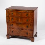 A walnut chest, circa 1920, of four drawers with brushing slide on bracket feet, 76.