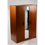 A 1950s double wardrobe/with central mirrored panel, 120cm wide, 172cm high, 58cm deep,