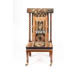 A Victorian upright prie-dieu chair with spiral turned columns to the sides,