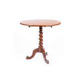 A Victorian mahogany oval table on a spiral turned column and tripod support,