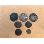 An Edward I penny (London), three Elizabeth I six pence pieces,