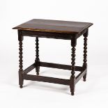A rectangular oak table with bobbin-turned legs united by square stretchers,