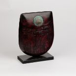 Peter Hayes (born 1946), a red raku bow form with turquoise disc, incised signature to plinth base,