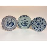 An 18th Century Bristol tin glazed plate, painted sailing boats within a polychrome border,