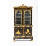 A fine Regency black and gold lacquer cabinet with pierced surmount and decorative frieze of