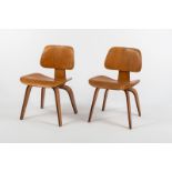 Charles and Ray Eames for Herman Miller/A pair of DCWs (Dining Chair Wood), American 1950s, plywood,