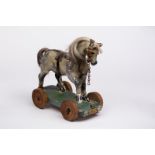 A child's toy horse on wheels, label to front Benetfink & Co, Cheapside, London EC,