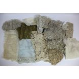 A lace and gilded thread dress border, various lace veils, collars, cuffs, etc.
