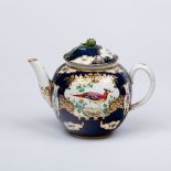 A Worcester style blue scale teapot painted exotic birds within shaped reserves,