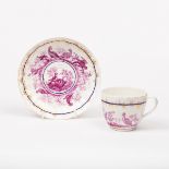 A Derby cup and saucer, circa 1790, later decorated in puce with birds,