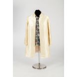 An Indian coat with Nehru collar in buttermilk silk with foliate motif CONDITION REPORT: