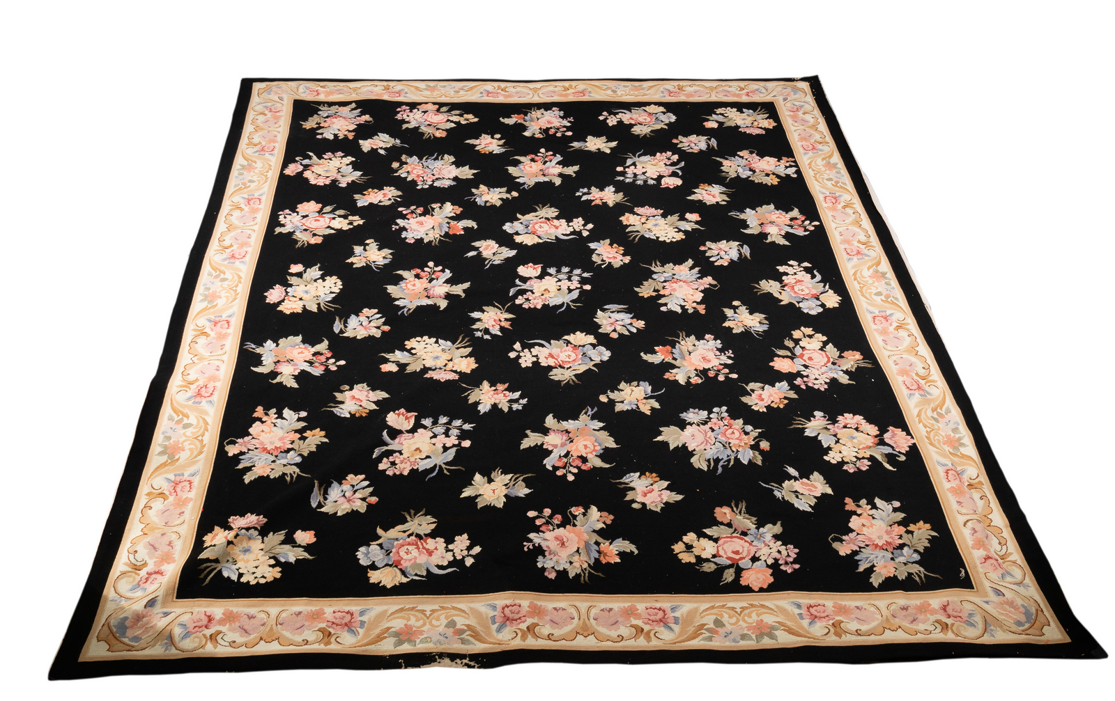 An Aubusson style wool carpet decorated a field of flower sprays and bouquets on a black background