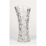 A Bohemian crystal cut vase in the mid-century style, with geometric designs and asymmetric neck,