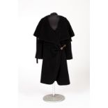 Sonia Rykiel, Paris, a black angora and wool coat with cape collar, wrap front and side fastening,