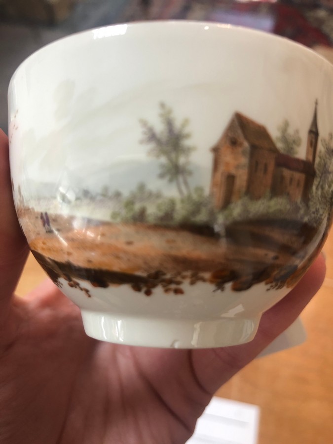 A Furstenberg teacup and saucer, late 18th Century, painted landscapes and scattered sprigs, - Image 3 of 7