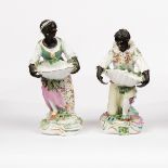 Two Derby blackamoor sweetmeat figures, circa 1765-1770, each modelled holding a shell,