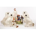 Two pairs of Staffordshire dogs, a single dog, a figure of Albert,