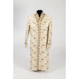 An Indian ivory silk coat with boteh and foliate embroidery in gold, bronze and claret,