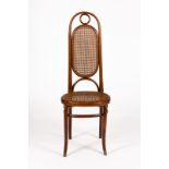 A Thonet bentwood chair with arch top cane back and seat on splay legs