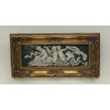 A resin plaque depicting putti riding dolphins, 15cm x 42.