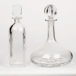 Two Orrefors glass decanters, one of square form with flattened stopper, 29cm high,