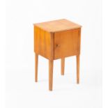 Gordon Russell Workshops/A veneered oak bedside cupboard, 1950s, on tapering legs, stamped mark,