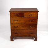A Georgian mahogany chest of three long and two short drawers on bracket feet,