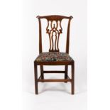A George III fruitwood chair with pierced upright splat back,