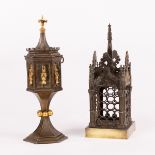 A Gothic Revival candle holder modelled as a tabernacle with decorative finials and trellis work