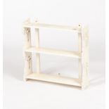 A set of white painted Gothic style hanging shelves CONDITION REPORT: The total size