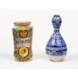 An Italian polychrome maiolica albarello, 17th Century, inscribed LoC De PINO, 20cm high,