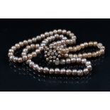 Miriam Haskell, a double strand faux pearl choker necklace with flower cluster clasp,