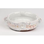 Pat Fuller (Contemporary), a white glazed fruit bowl with ropetwist handles, impressed mark to side,